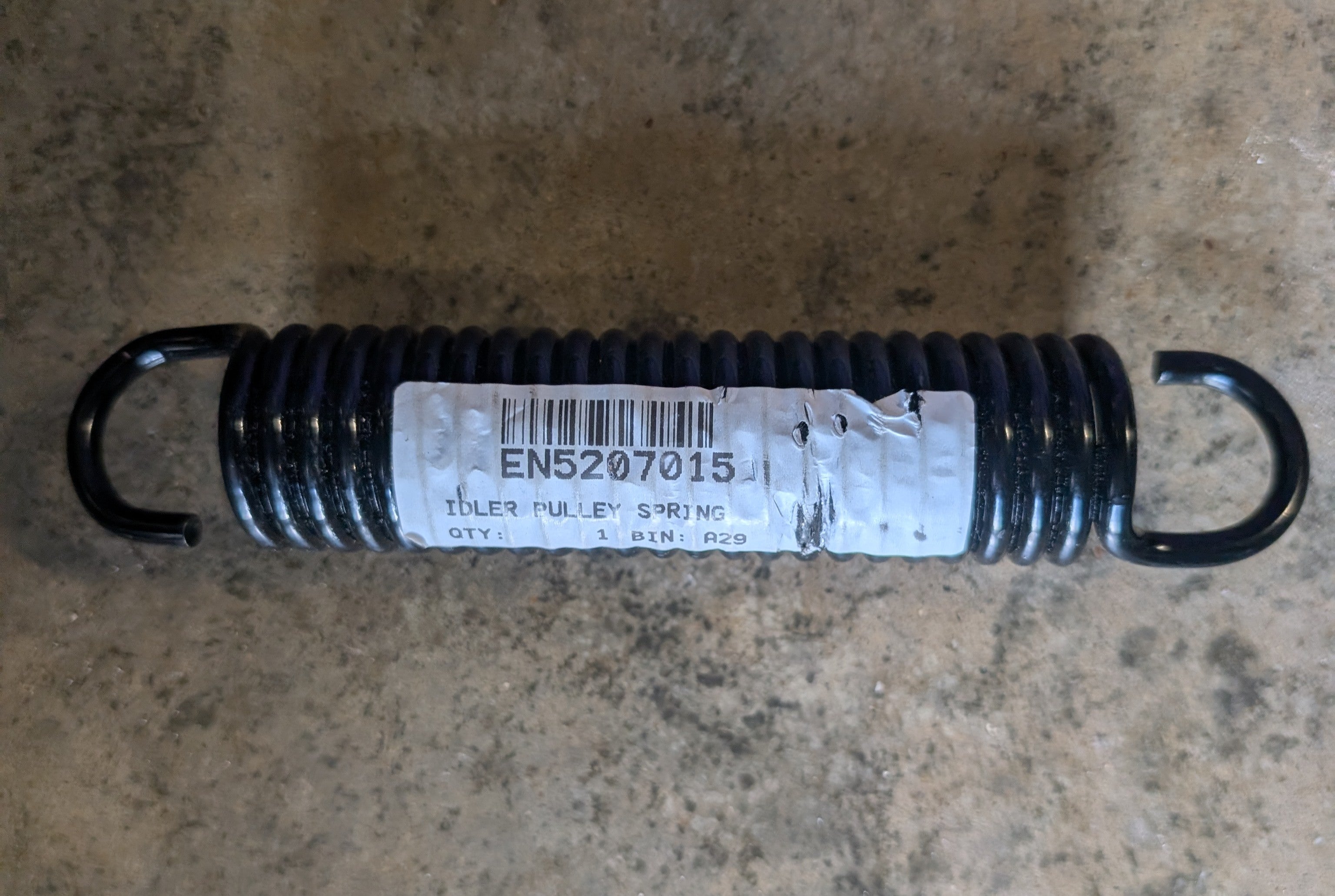 5207015 - IDLER PULLEY SPRING image 0